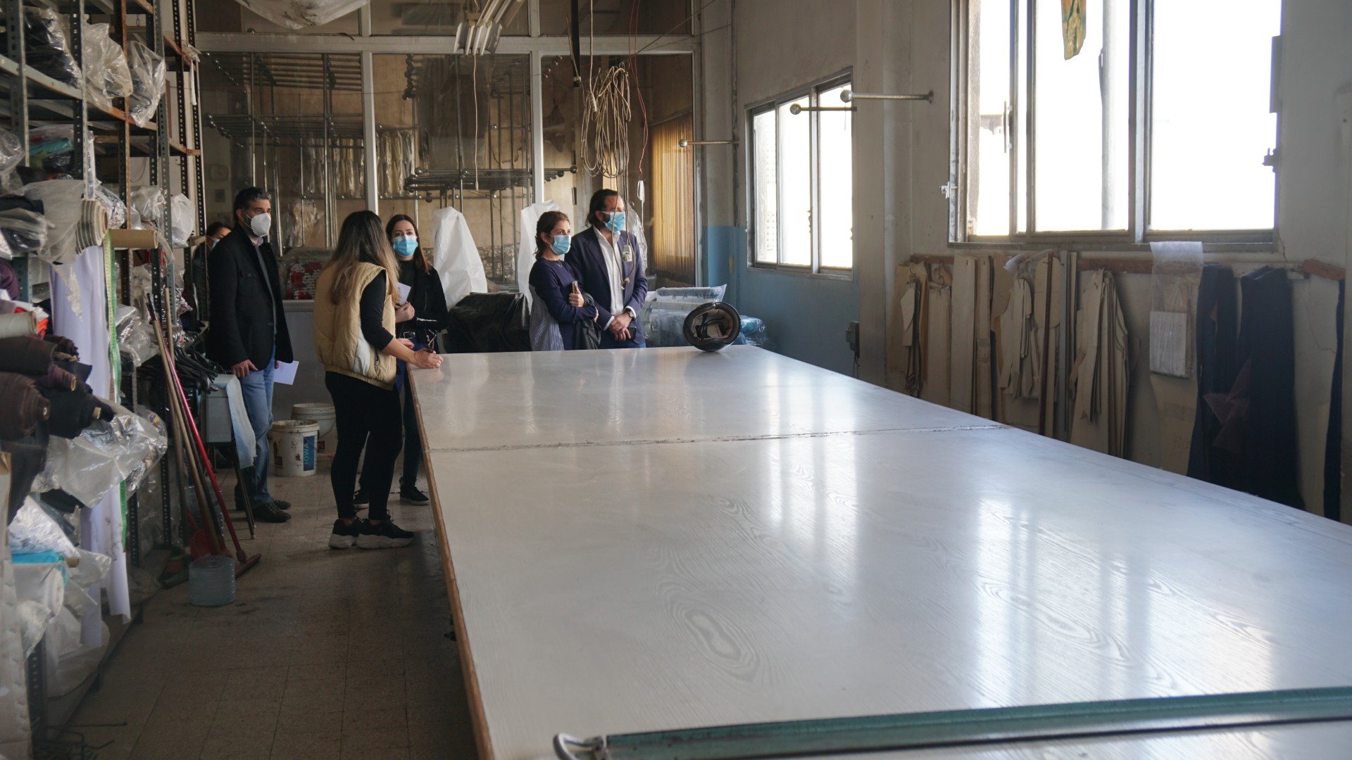 Visitors inspecting Bacchour Clothing Factory