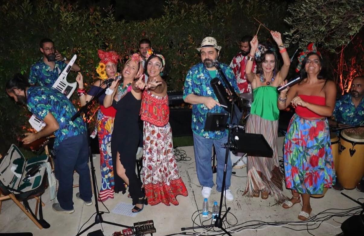 A Cuban Night troupe sings and plays percussion in the garden